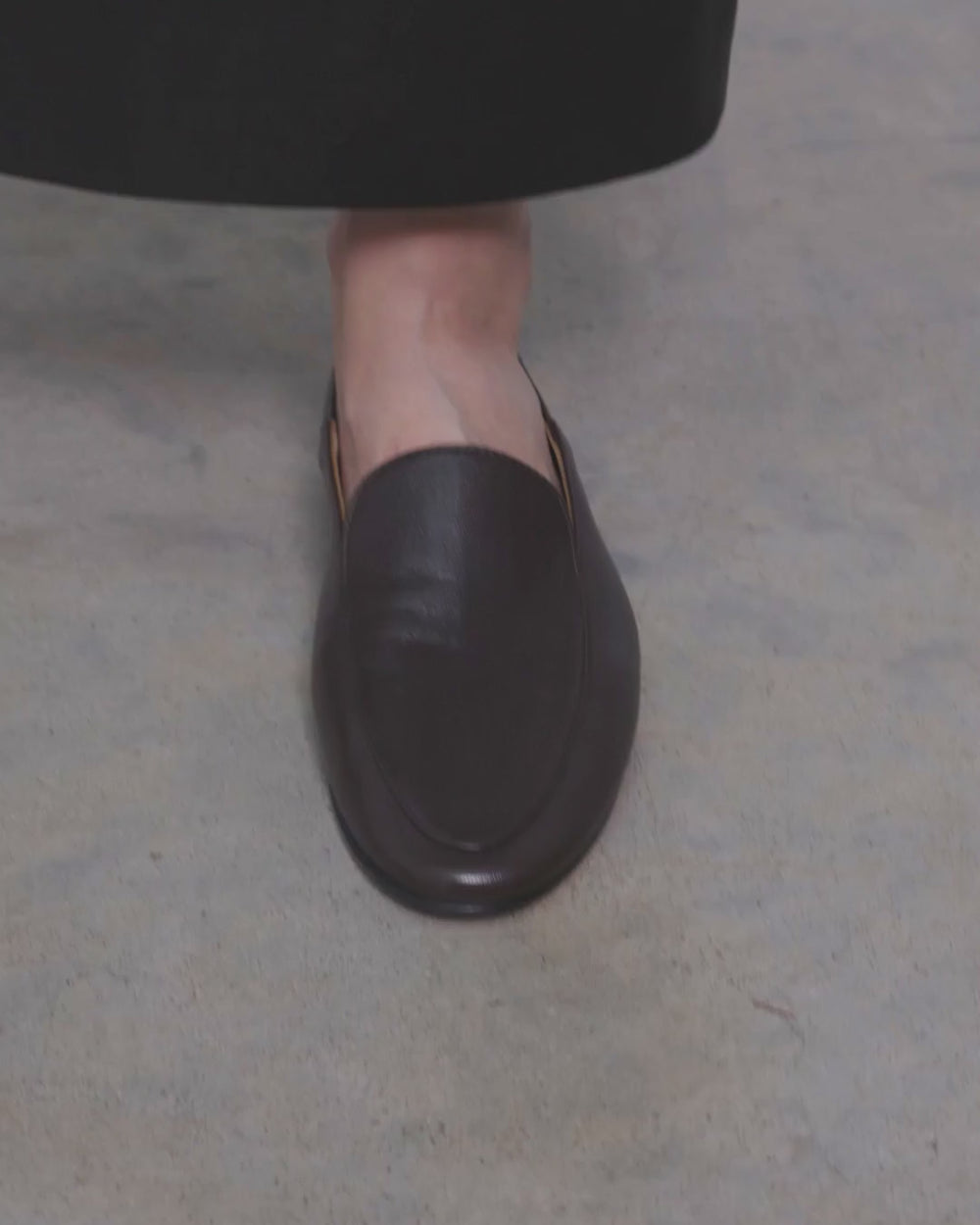 Model walking in Dear Frances Gio Loafers in espresso leather, showing the soft unlined upper and flat sole