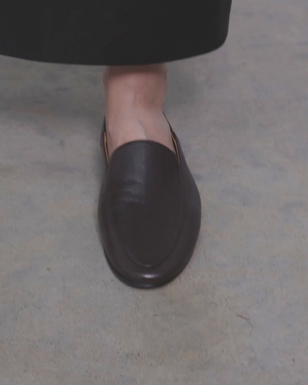 Model walking in Dear Frances Gio Loafers in espresso leather, showing the soft unlined upper and flat sole